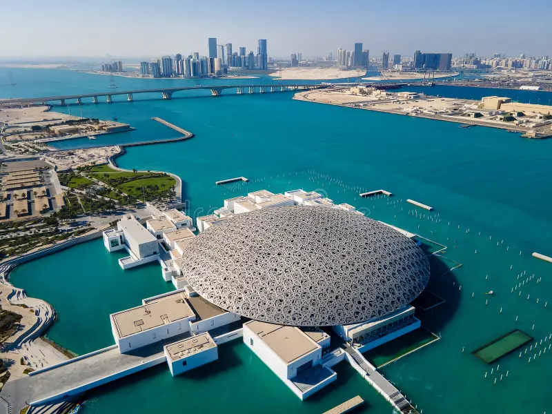abu-dhabi-united-arab-emirates-april-louvre-museum-aerial-emirate-skyline-uae-capital-cityscape-rising-seaside-216691674